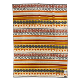 Blanket with horizontal stripes in red, gold, gray, and ivory, featuring visible Norwegian-inspired roses, leaves, and geometric patterns.