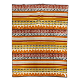 Woven Swedish blanket with orange, yellow, gray, and white horizontal stripes and alternating rows of floral and geometric patterns.