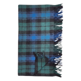 Folded Black Watch tartan blanket in blue and green plaid with fringed edges, displayed flat on a plain white background.