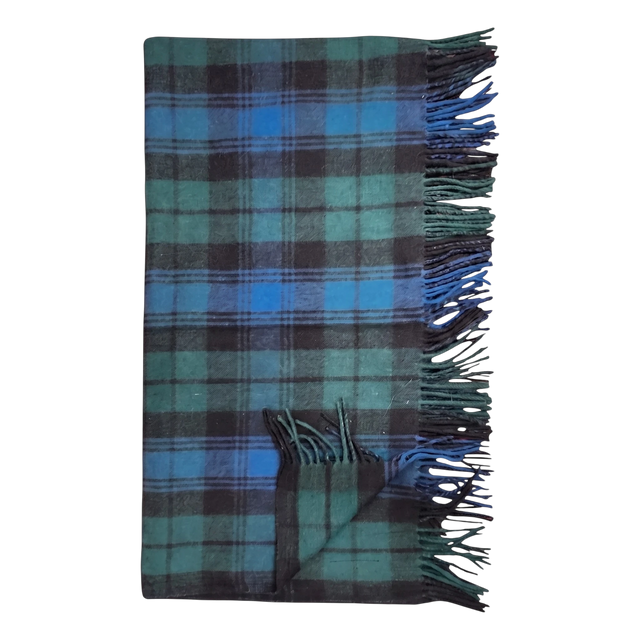 Folded Black Watch tartan blanket in blue and green plaid with fringed edges, displayed flat on a plain white background.