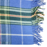 Blue Highland tartan blanket with green, white, and orange stripes and fringed edges, shown on the right side.