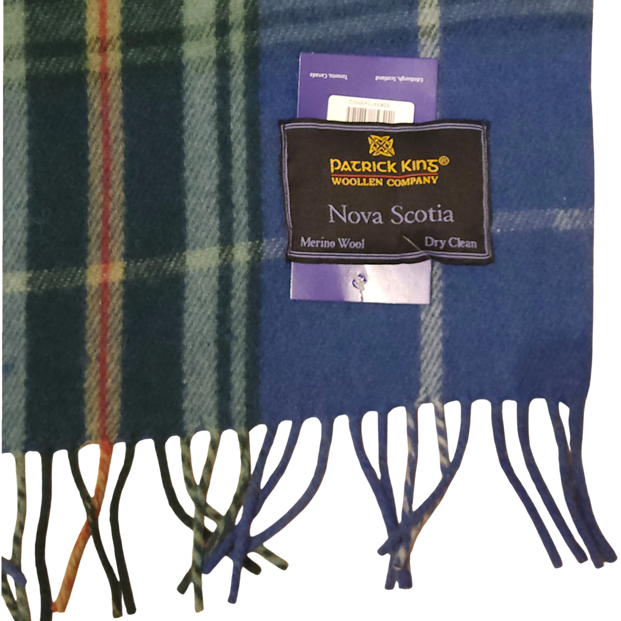 Blue and green Scottish tartan scarf with fringe, featuring a label that reads Patrick King Woollen Company, Nova Scotia, Merino Wool, and Dry clean only.