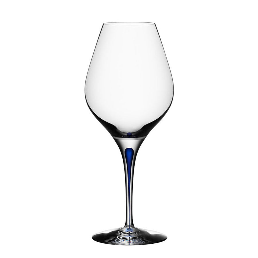 The Orrefors Intermezzo Blue Aroma Glass 20oz is a crystal glass featuring a wide bowl and slender stem with a subtle blue tint at the base.