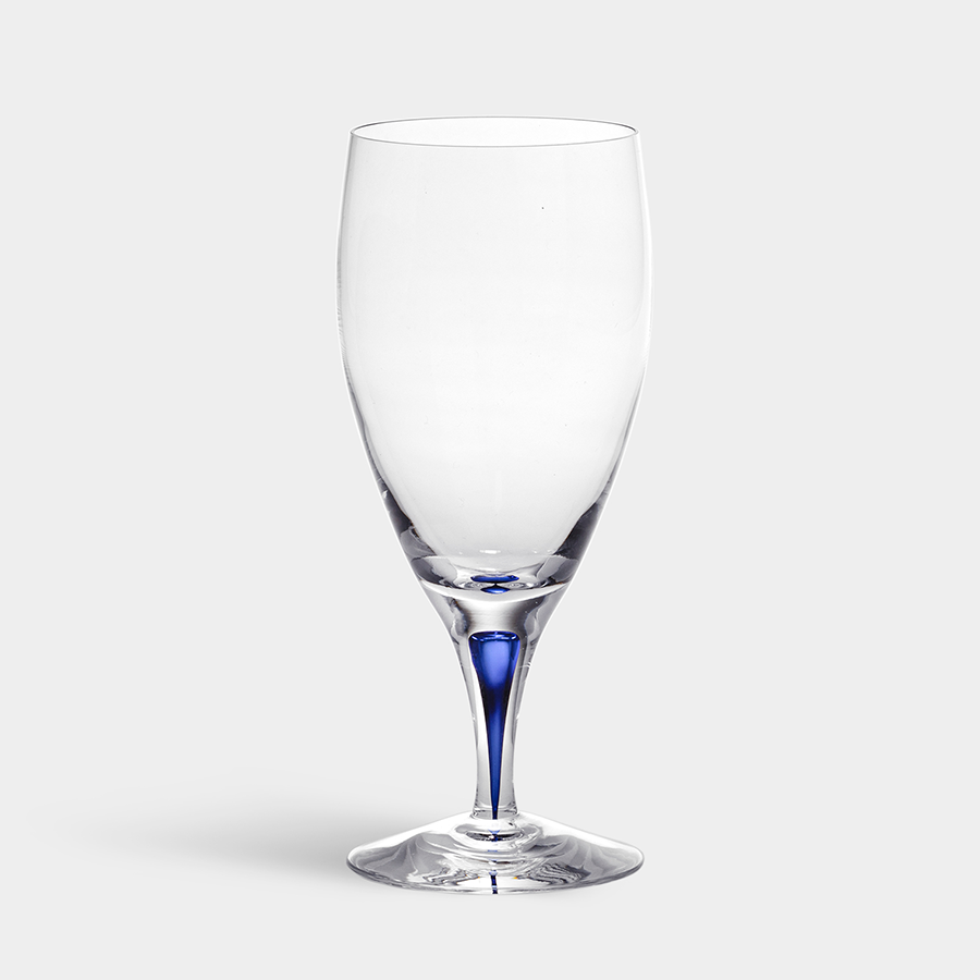 The Orrefors Intermezzo Blue Iced Beverage Glass 15oz, designed by Erika Lagerbielke, showcases a stunning blue stem section set against a grey backdrop.