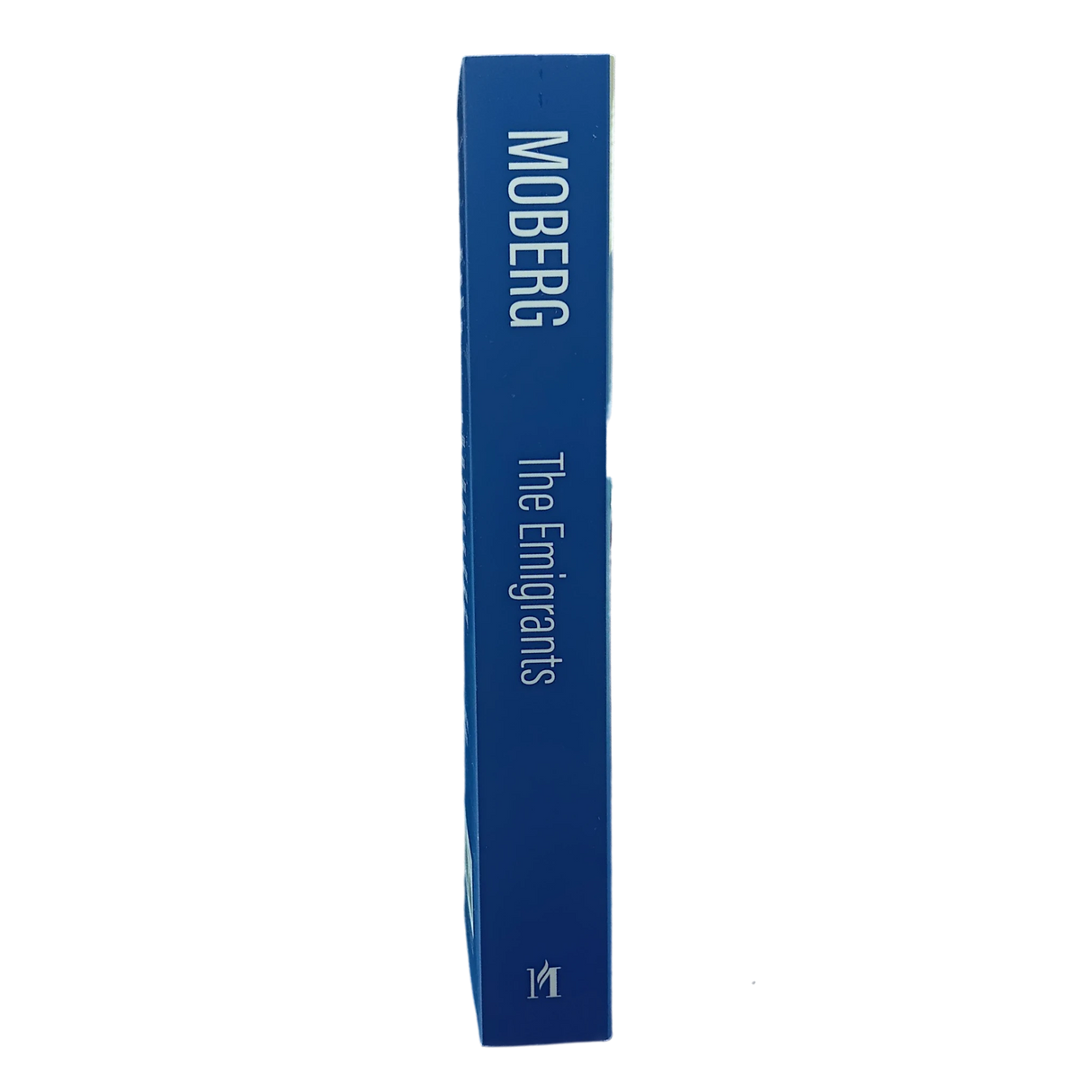 Blue hardcover book with spine text “The Emigrants Vilhelm Moberg” displayed upright against a plain white background.