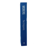 Blue hardcover book with spine text “The Emigrants Vilhelm Moberg” displayed upright against a plain white background.