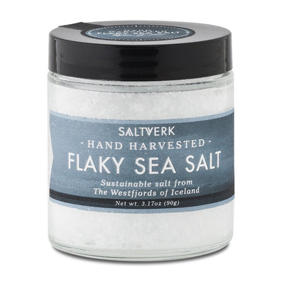 A jar of Saltverk hand-harvested Flaky Icelandic Sea Salt, celebrated for its sustainability and originating from the Westfjords of Iceland, comes in a net weight of 3.17 oz (90g) as part of the Salt: Saltverk - 2-Flavor Gift Box (2-Pack).