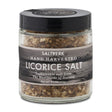 A 90g glass jar of Saltverk Hand Harvested Licorice Salt from the Westfjords of Iceland, featuring flaky sustainable sea salt crystals and a black screw-on lid.