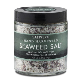 A 90g glass jar of Saltverk Seaweed Salt, hand harvested and sustainable from Icelands Westfjords, with visible salt and seaweed flakes.