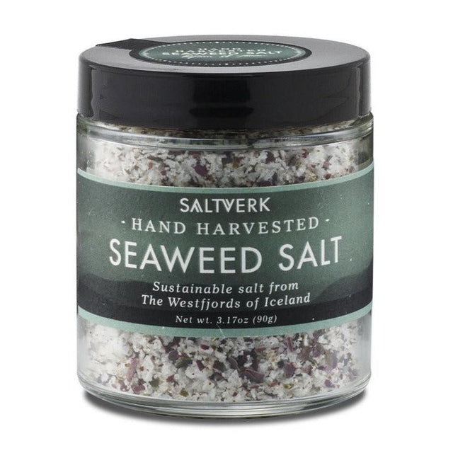 A 90g glass jar of Saltverk Seaweed Salt, hand harvested and sustainable from Icelands Westfjords, with visible salt and seaweed flakes.