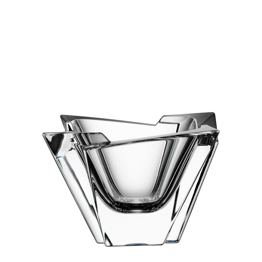 The Orrefors: Glacial Bowl Medium, made of crystal-clear glass, boasts angular overlapping edges for a striking geometric design against a white background, capturing light and attention with its refined elegance.