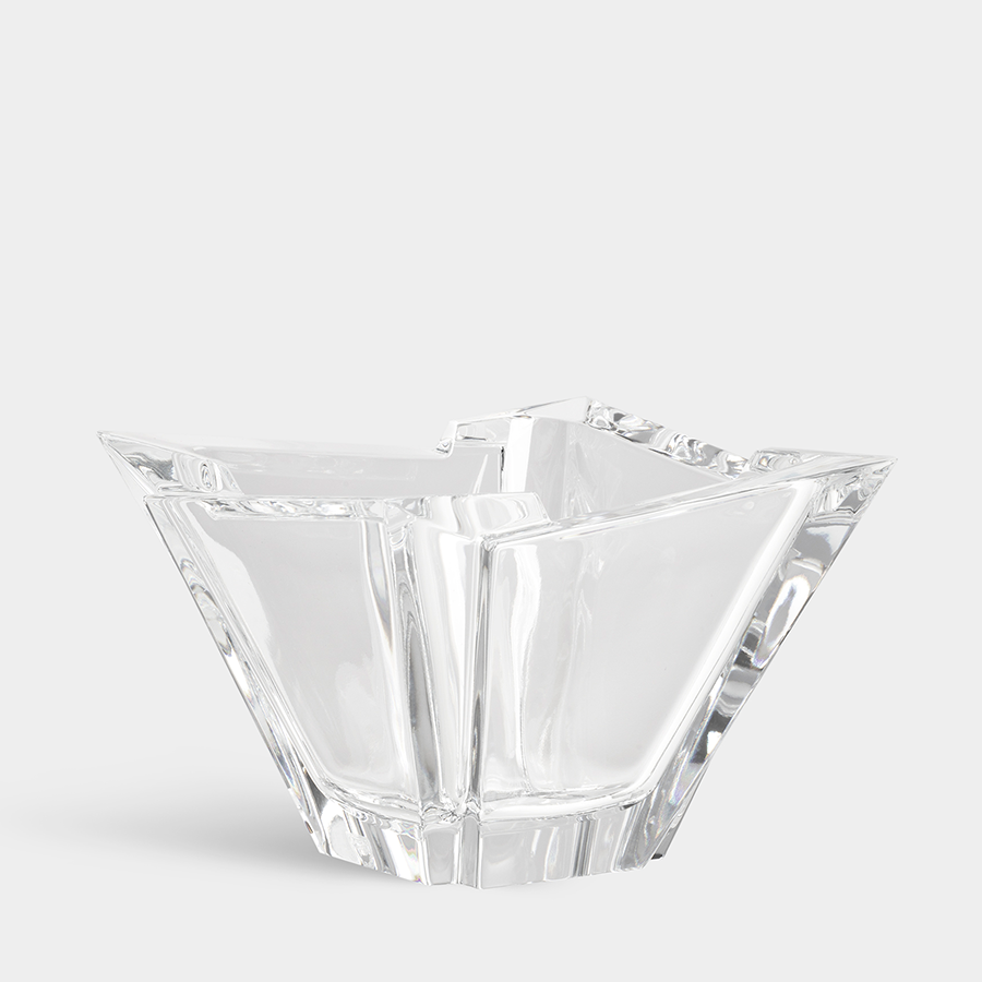 A geometric Orrefors Glacial Bowl Medium, a crystal-clear glass piece with angular lines and facets, set against a plain background.