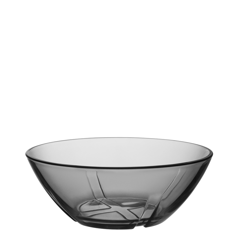 The KostaBoda: Bruk Gray Bowl Small, designed by Anna Ehrner, showcases transparent grey-tinted glass with a smooth, minimalist design and round base.