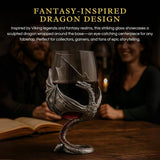 A Wine Glass: Medieval Dragon Viking Goblet Mug (9oz) with a sculpted dragon base rests on a table next to an open book, as two people sit in the softly lit background.