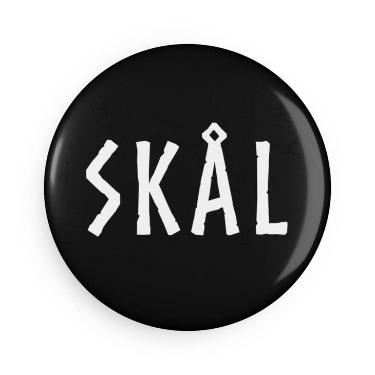 2.25-inch round magnet featuring a black button design with "SKÅL" in white capital letters.