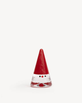 Clear glass gnome figurine with a tall red conical hat, a red nose, and two black dot eyes.