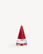 Clear glass gnome figurine with a tall red conical hat, a red nose, and two black dot eyes.