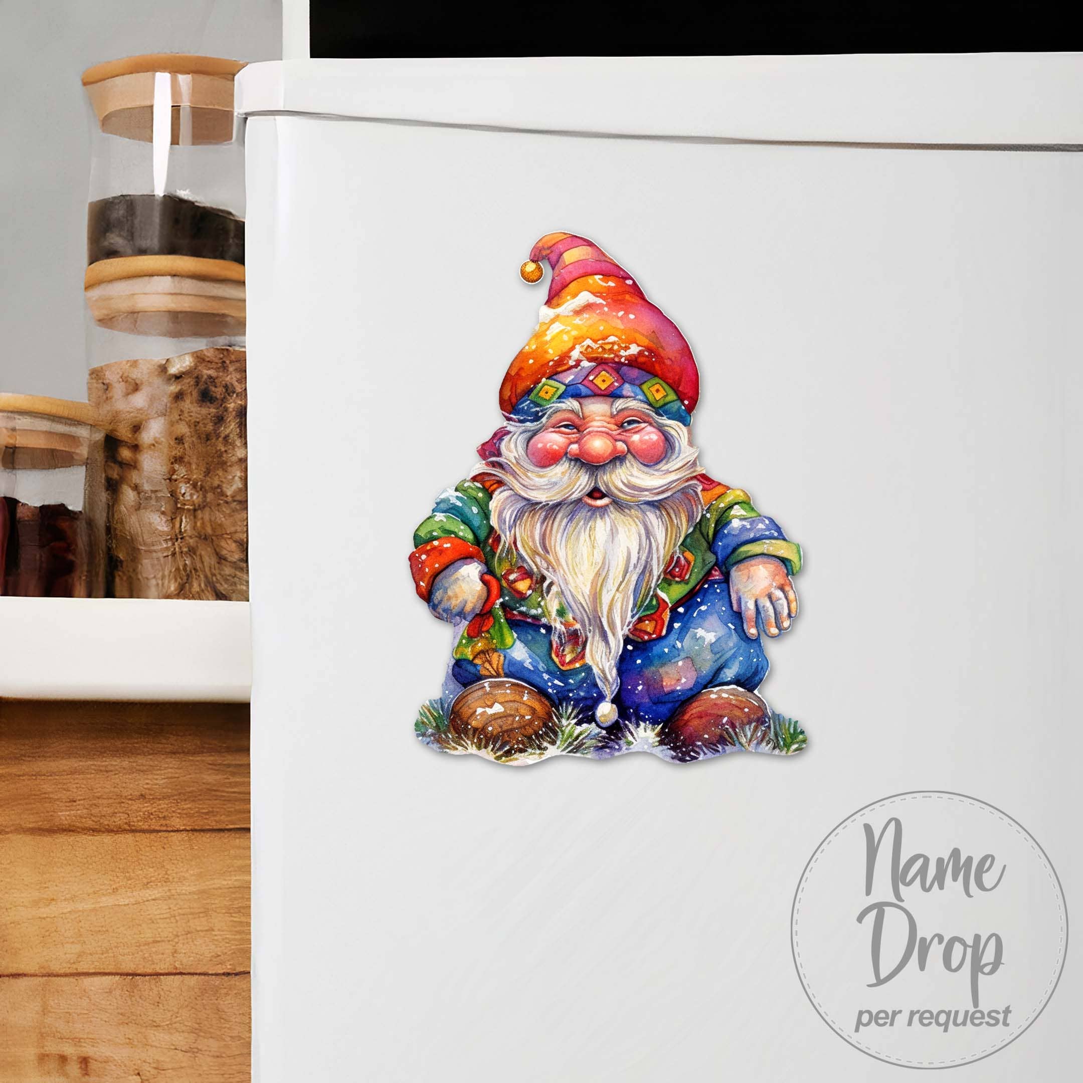 The white refrigerator is adorned with the Jolly Gnome Refrigerator Wooden Magnet, handcrafted in America, perfectly complementing the wooden kitchen canisters.