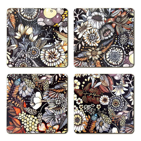 The Flores-Flowers Coaster set by Swedish artist Nadja Wedin includes 4 laminated birchwood coasters, each with a unique floral design in black, white, yellow, and orange on a dark background.