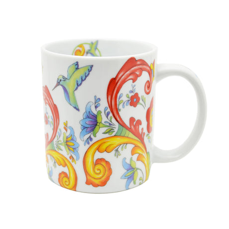 The Coffee Mug: Colorful Norwegian Rosemaling Coffee Mug 12 oz features white ceramic, vibrant floral patterns, red and yellow swirls, and a small green hummingbird near the rim, inspired by traditional Norwegian Rosemaling designs.