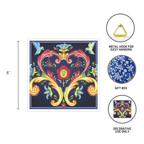 The Tile: Blue Norwegian Rosemaling Ceramic Wall Decor 6 Square Tile features a colorful floral pattern, metal hanging hook, and gift box—ideal as decorative-only ceramic wall art for a Scandinavian kitchen.