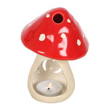 The Mushroom Tealight Candle Holder – Ceramic Nordic Accent (6" × 4.5") features a red cap with white spots, adding whimsical charm to your décor while holding a glowing tealight at the base.