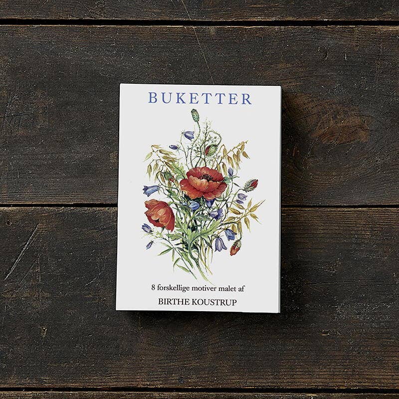 The Card Pack: Bouquets - Buketter, featuring quality greeting cards with floral illustrations on the cover, rests gracefully on a wooden surface, complete with 8 cards and envelopes.