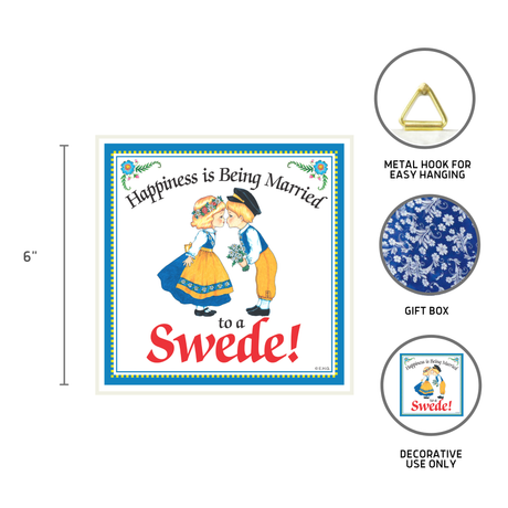 The Happiness is Being Married to a Swede 6x6 ceramic tile features Swedish couple art and text, comes with a metal hook and gift box, and makes a charming decorative kitchen wall plaque. For decoration only.
