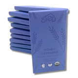 A stack of chocolate bars labeled Honey Lavender, 50% organic milk chocolate, with USDA organic seal and notes indicating soy free, gluten free, and palm oil free.