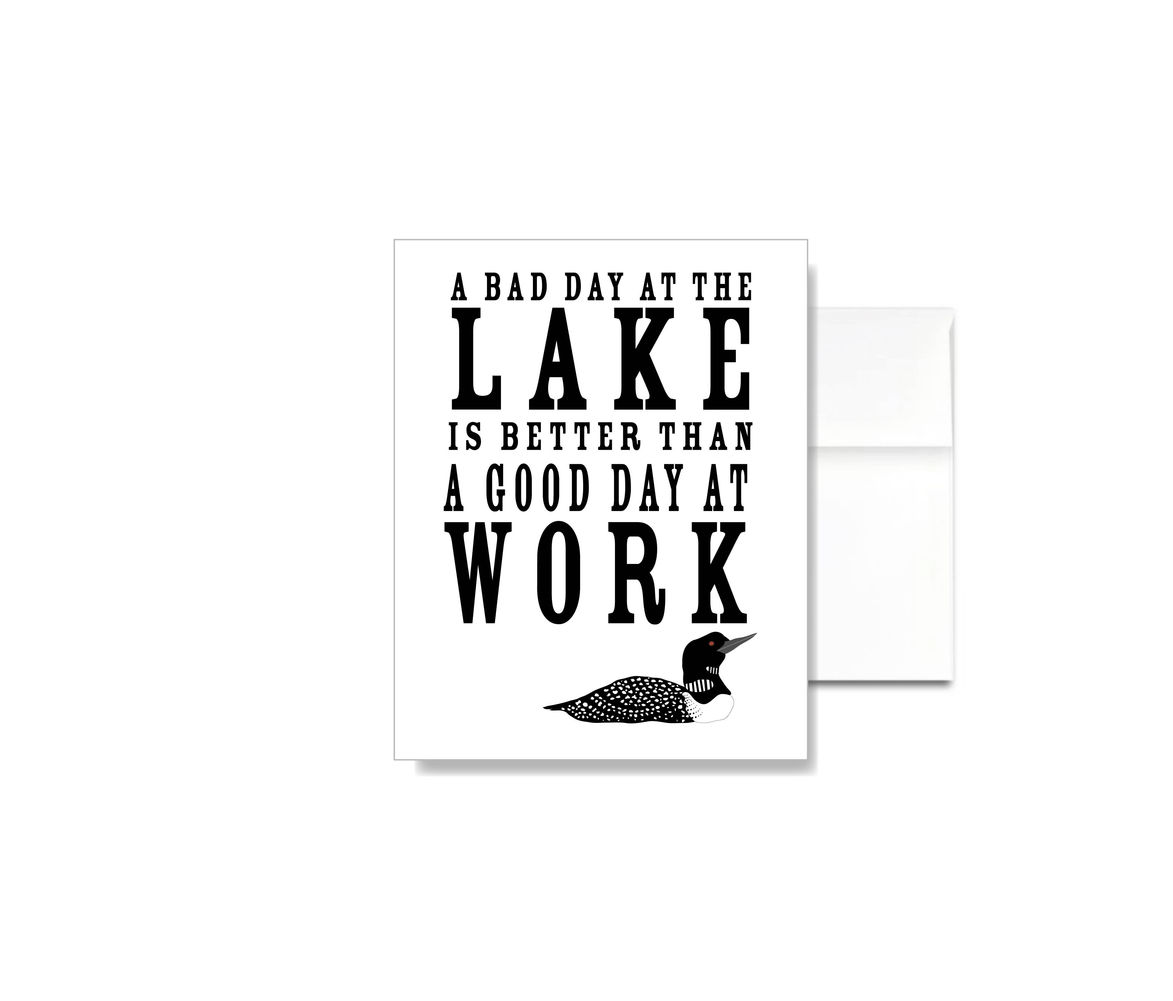 The A Bad Day at the Lake is Better than a Good Day at Work Card features linen texture, lake-inspired text, and a loon illustration—perfect for lakehouse stationery fans and as a thoughtful greeting card.