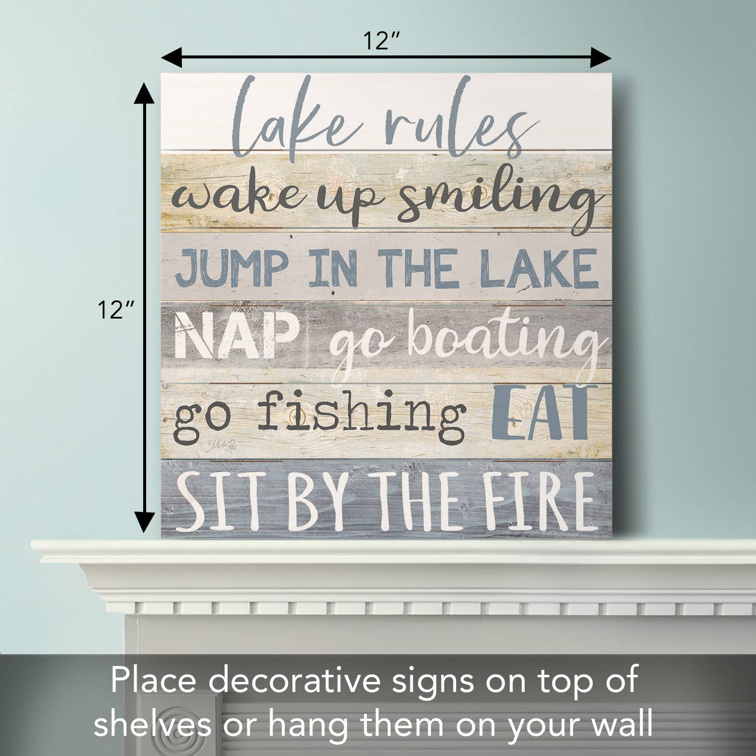 The "Lake Rules" Decorative Slatted Pallet Wood Sign, made from solid pine wood slats, features charming lake-inspired rules: wake up smiling, jump in the lake, nap, go boating, fish, eat, and sit by the fire. It's an ideal wall décor piece to infuse your space with a rustic lakeside charm.