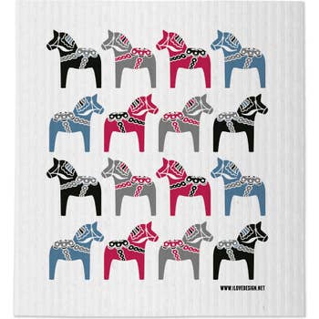 A group of horses on a white surface, evoking the clean freshness of the super absorbent Swedish Dala Horse Multi Colors Dish Cloth—an environmentally-friendly towel.