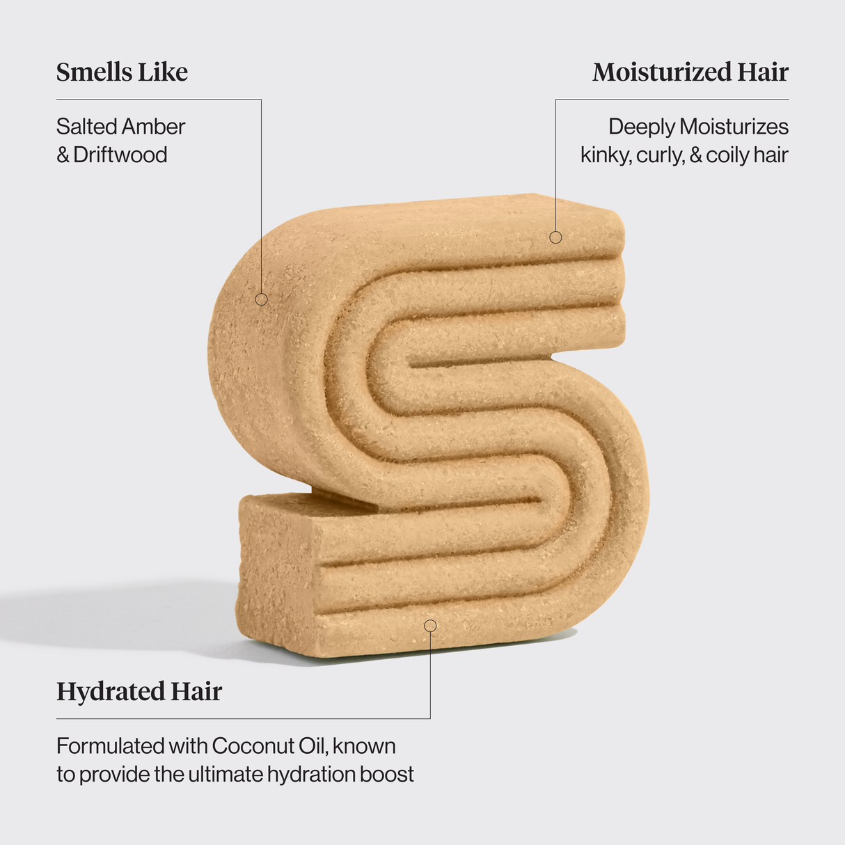 The Hair: Coconut Oil Shampoo & Conditioner Bar Combo for Dry Damaged Hair by Kitsch features 2 tan, S-shaped bars that hydrate and moisturize curly hair with a coconut scent, ideal for kinky, curly, and coily textures.