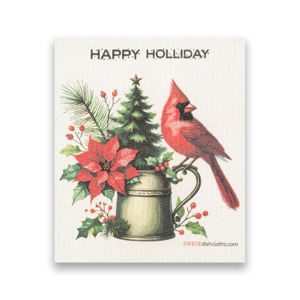 Swedish Dishcloth: Christmas Cardinal with Poinsettia features a cardinal on a green mug, poinsettia, holly, pine branches, and a tiny tree. "HAPPY HOLIDAY" text above. Eco-friendly and festive for your kitchen!.