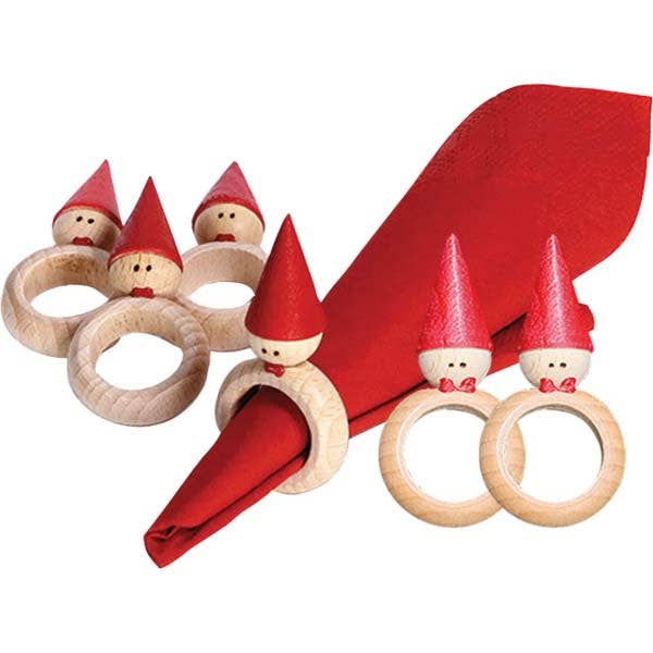 These Tomte Finland Napkin Rings, crafted in the shape of small figures with red hats and bows, capture Scandinavian heritage while elegantly holding vibrant red napkins.