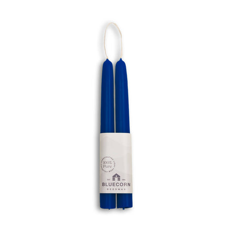 Two eco-friendly, dripless blue taper candles, branded Candles: Beeswax Taper Candles – Eco-Friendly, Dripless & Handmade, are crafted from beeswax and feature a white label for a clean burning experience.