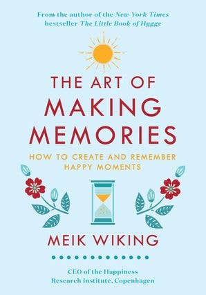 Book cover of The Art of Making Memories by Meik Wiking, showing flowers, an hourglass, and a sun, with the subtitle How to Create and Remember Happy Moments.