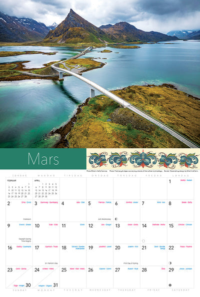 A picturesque March page from the 2025 "Splendor of Norway" calendar showcases a winding road over water and mountains, highlighting Norwegian holidays with notable events.