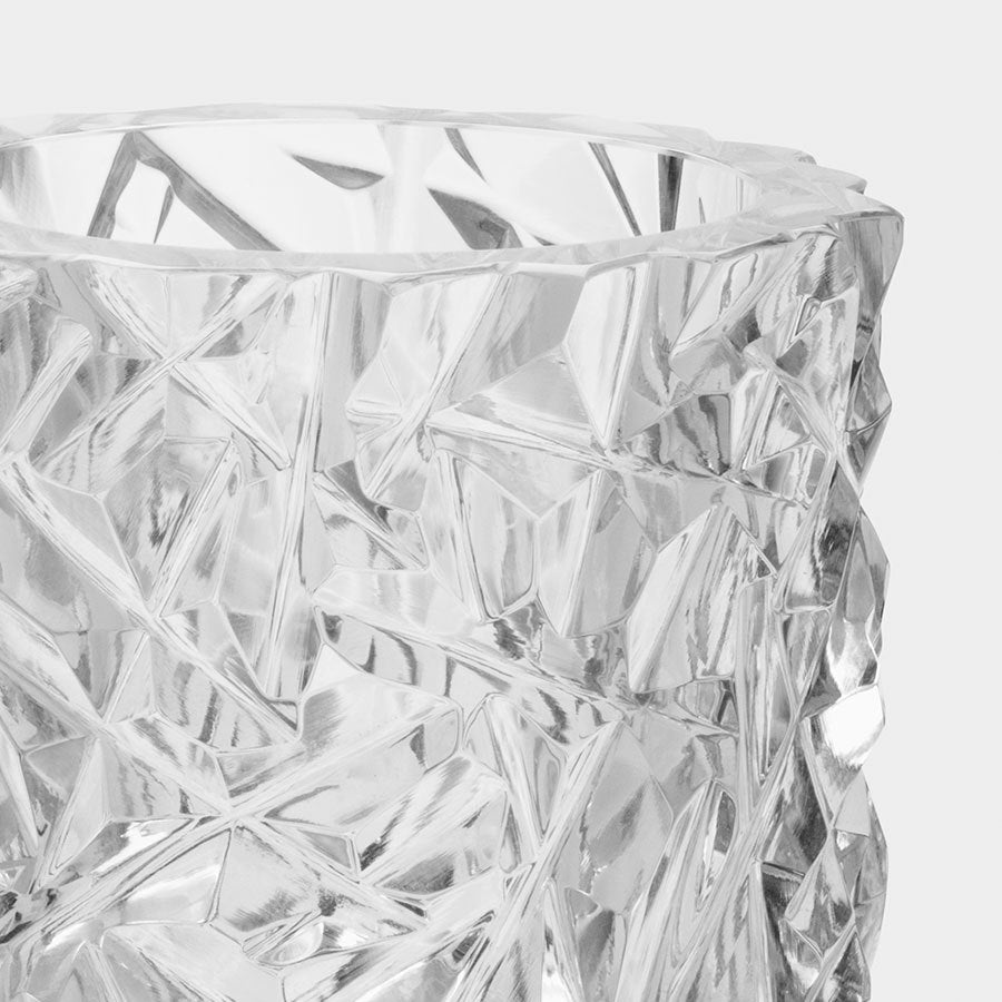 Close-up of a clear Orrefors Carat Candle Holder Small, with a faceted, geometric texture reminiscent of their exquisite crystal glass designs.