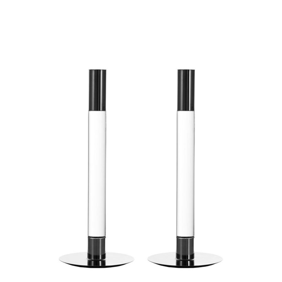 Two upright cylindrical black and white speakers on round silver bases evoke the design of Orrefors: Lumiere Candlestick Silver Medium - Set of 2.