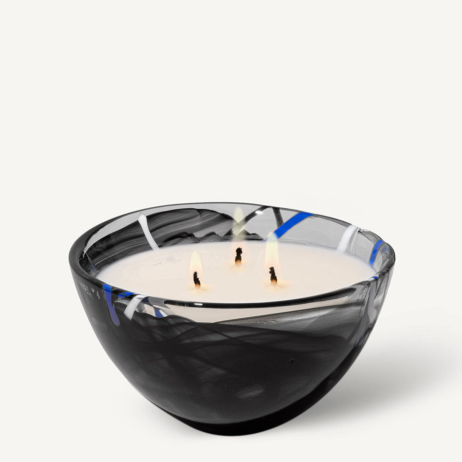 The KostaBoda: Home Fragrance Collection Contrast Black Candle - Blushing Pink features an abstract design in black, white, and blue, ideal for holding a three-wick candle.