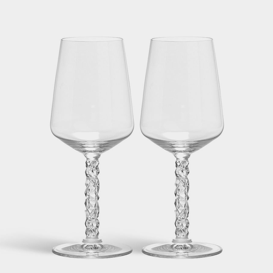 The Orrefors: Carat Wine Glass 14.8oz (2-Pack) features two elegant glasses with twisted stems, beautifully showcasing the brilliance of fine crystal design against a white backdrop.