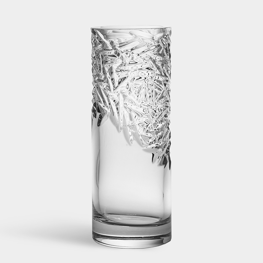 Orrefors: Carat Vase Upper Cut features a clear glass design with intricate, textured patterns reminiscent of an Orrefors tumbler, set against a plain background.