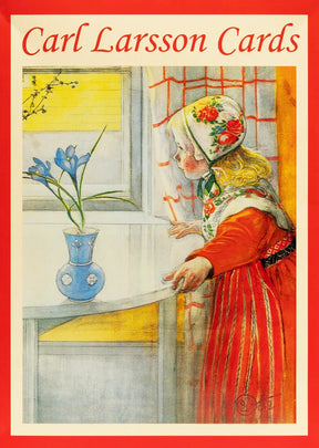 A young girl in a Swedish folk costume and floral cap looking out a window at a blue vase of irises.