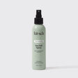 A green 6 fl oz bottle of KITSCH Spray: Texturizing Sea Salt Hair Spray with Rosemary & Biotin is displayed against a plain white background. This vegan hair product features clean ingredients and serves as both a volumizing spray and texturizer, making it ideal for creating effortless, beachy waves.