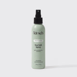 A green 6 fl oz bottle of KITSCH Spray: Texturizing Sea Salt Hair Spray with Rosemary & Biotin is displayed against a plain white background. This vegan hair product features clean ingredients and serves as both a volumizing spray and texturizer, making it ideal for creating effortless, beachy waves.
