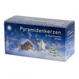 A blue box of Marketplace24 Candles: White Christmas Pyramid Candles (Pyramiden-Kerzen), featuring a snowy winter cabin, tree, and star illustration on the front. The German text describes a box of 50 candles (14 x 70mm) for small Christmas pyramids.