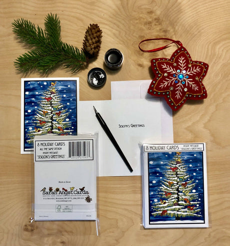 The Card Pack: Birds in Snow on Tree Packaged Christmas Cards includes 8 cards and envelopes, featuring a festive tree with birds in snow, perfect for holiday greetings.