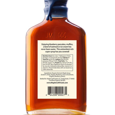 The back of the Blueberry Maple Syrup bottle lists nutritional facts and antioxidant-rich ingredients, suggests pairing with blueberry pancakes, and includes a website link.
