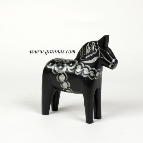 The Dala Horse: Celebrate Series Swedish Dala Horse Black & Silver stands elegantly on a plain white background with its hand-carved design and silver kurbits patterns.